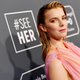 Betty Gilpin wears a pink dress on the red carpet in 2020.